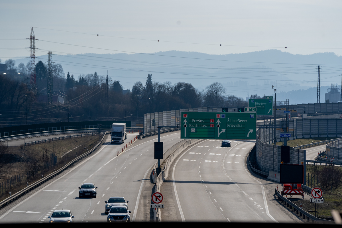 Classic Czech motorway scene on D3 with green overhead junction signs directing to Prešov, Bratislava on D1 and Žilina-Sever, Prievidza with multiple lanes and traffic visible, February 2026