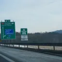Czech D8 motorway direction signs to Dresden and Petrovice on E55 with vignette required warning sign indicating vignette enforcement begins in 800 metres ahead, February 2026