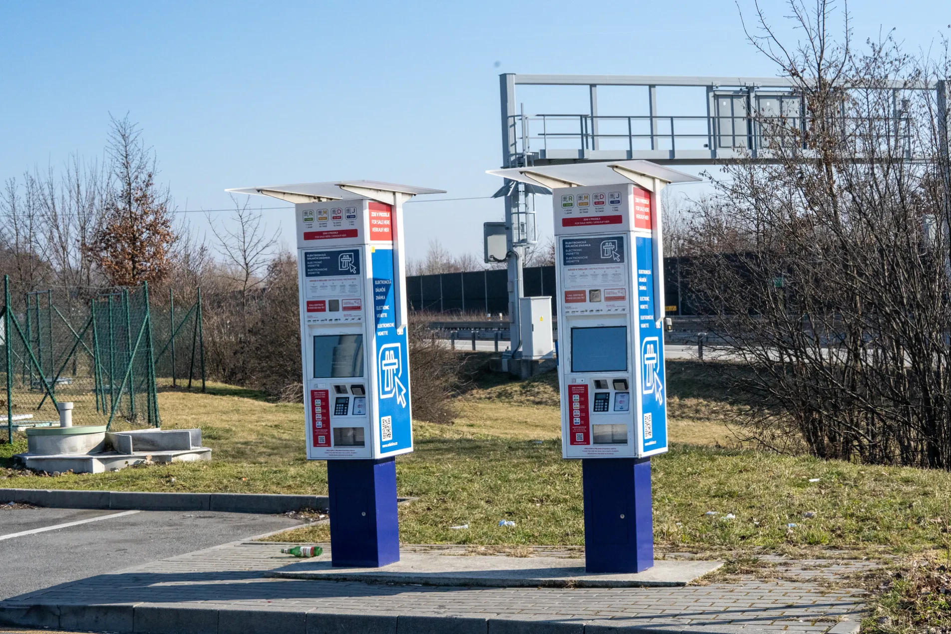 Two Czech e-vignette self-service machines showing all vignette price options (1 year, 30 days, 10 days, 1 day) at a motorway rest area in the Czech Republic
