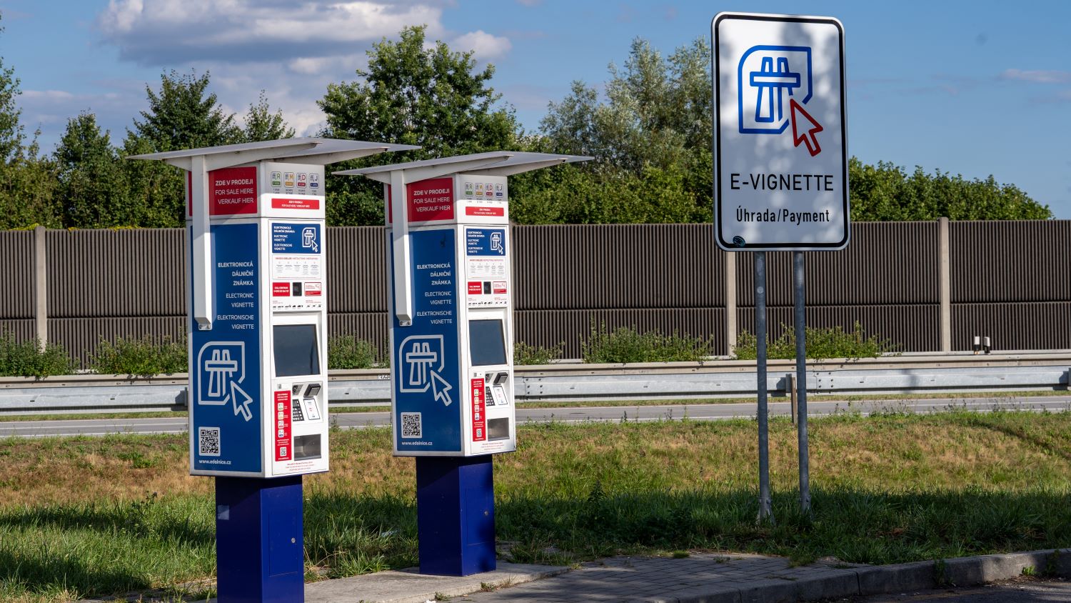 Two e-vignette machines and an E-Vignette payment sign beside the D1 motorway in Czechia, selling vignettes from 1 day to 1 year