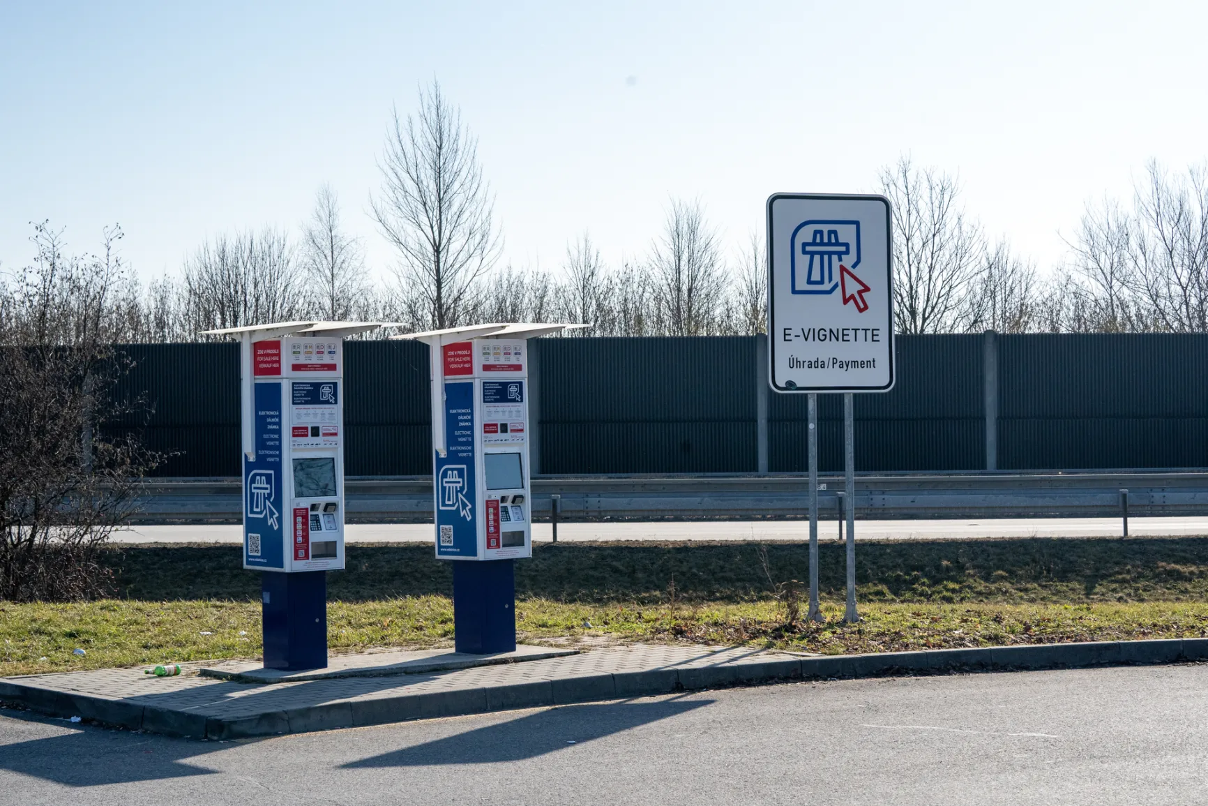 Czech e-vignette validity check and payment machines with Úhrada/Payment sign at a motorway rest area, where drivers can verify and purchase their Czech motorway vignette